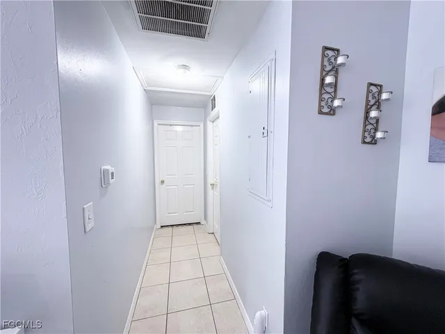 a view of a hallway view with a mirror