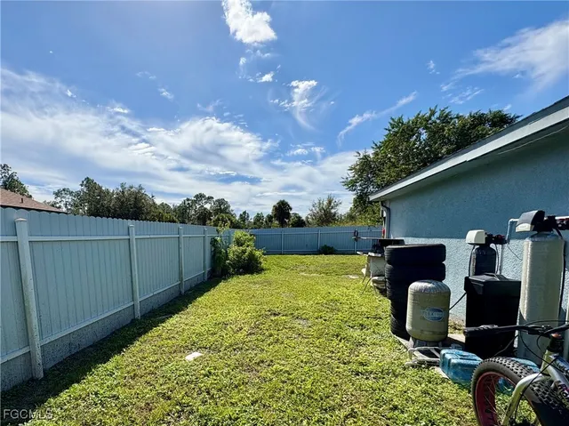 a view of a backyard with hardwood