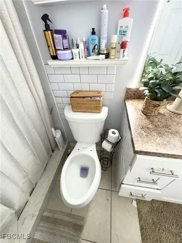 a bathroom with a sink and toilet