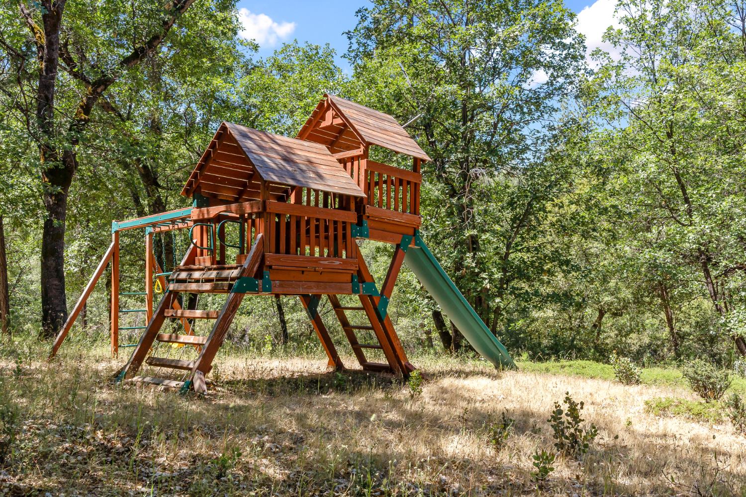 2640 Trail Gulch Road Placerville, CA 95667 - Photo 25 of 37 a view of wooden house with a yard and deck