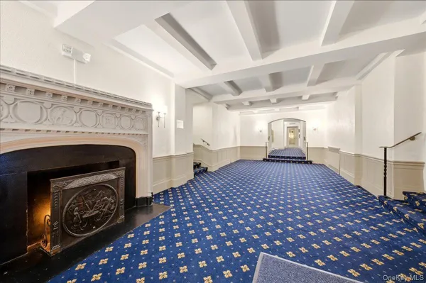 a bedroom with a bed and a fireplace