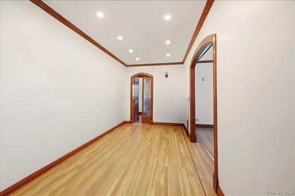 a view of a big room with wooden floor and sliding door