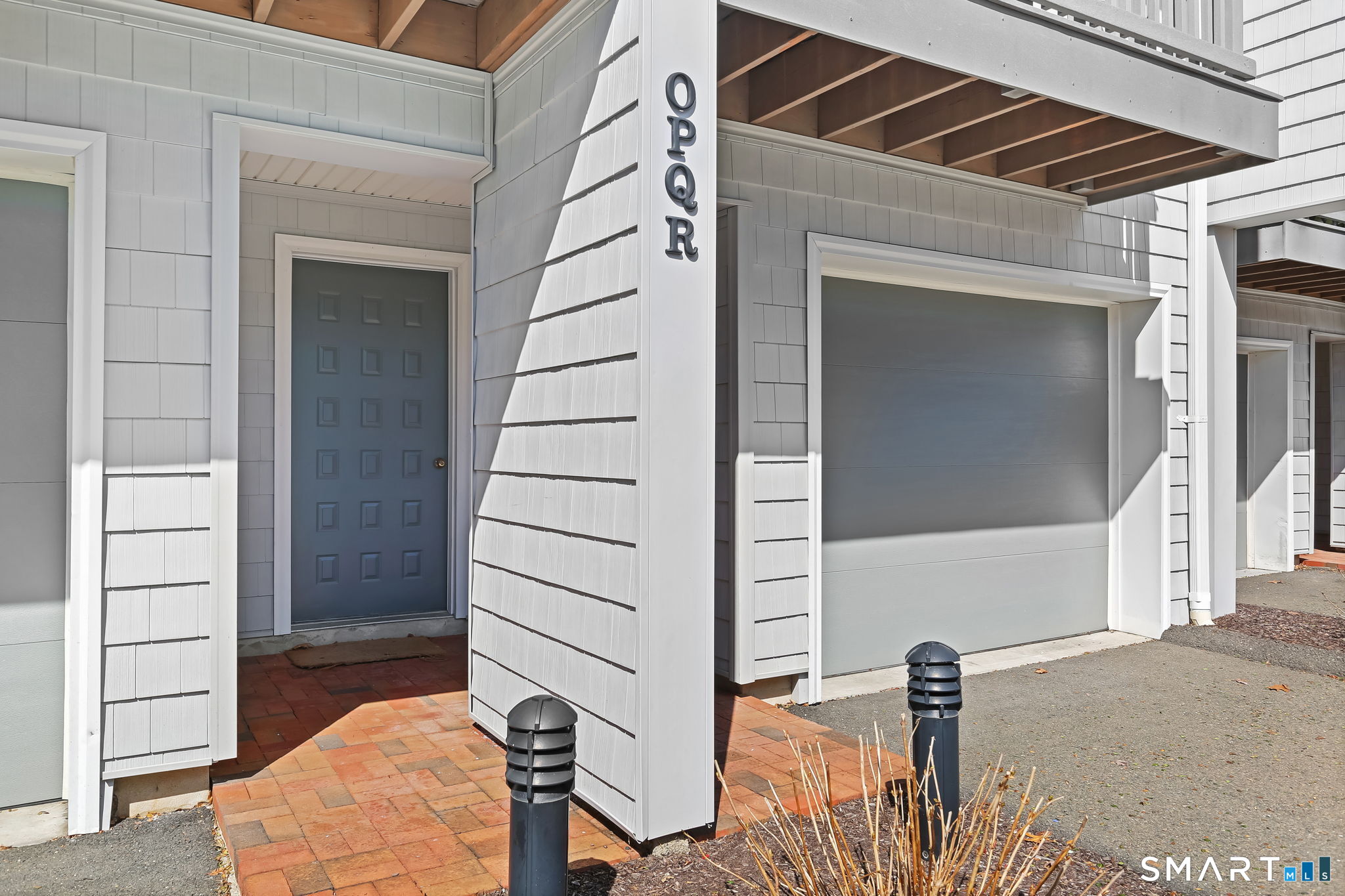 16 Rockmeadow Road, Unit Q Norwalk, CT 06850 - Photo 3 of 33 Main Entrance between garages