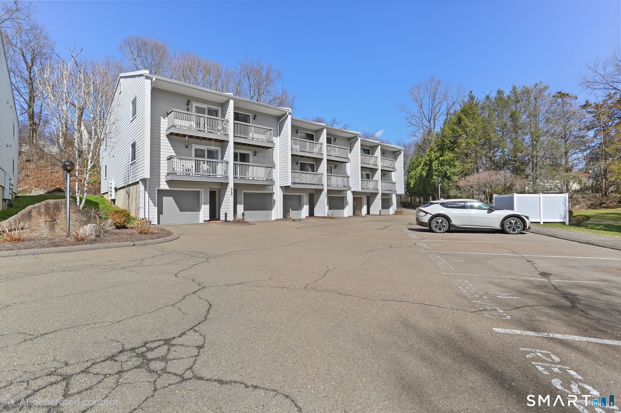 16 Rockmeadow Road, Unit Q Norwalk, CT 06850 - Photo 32 of 33 White car is in unit's reserved space (Q)