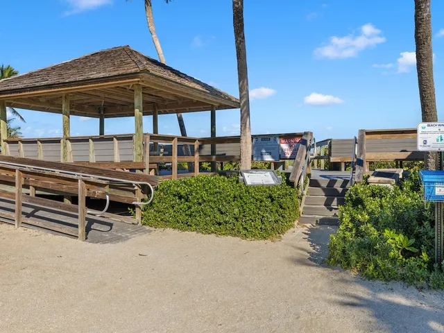 an outdoor view of patio with umbrella