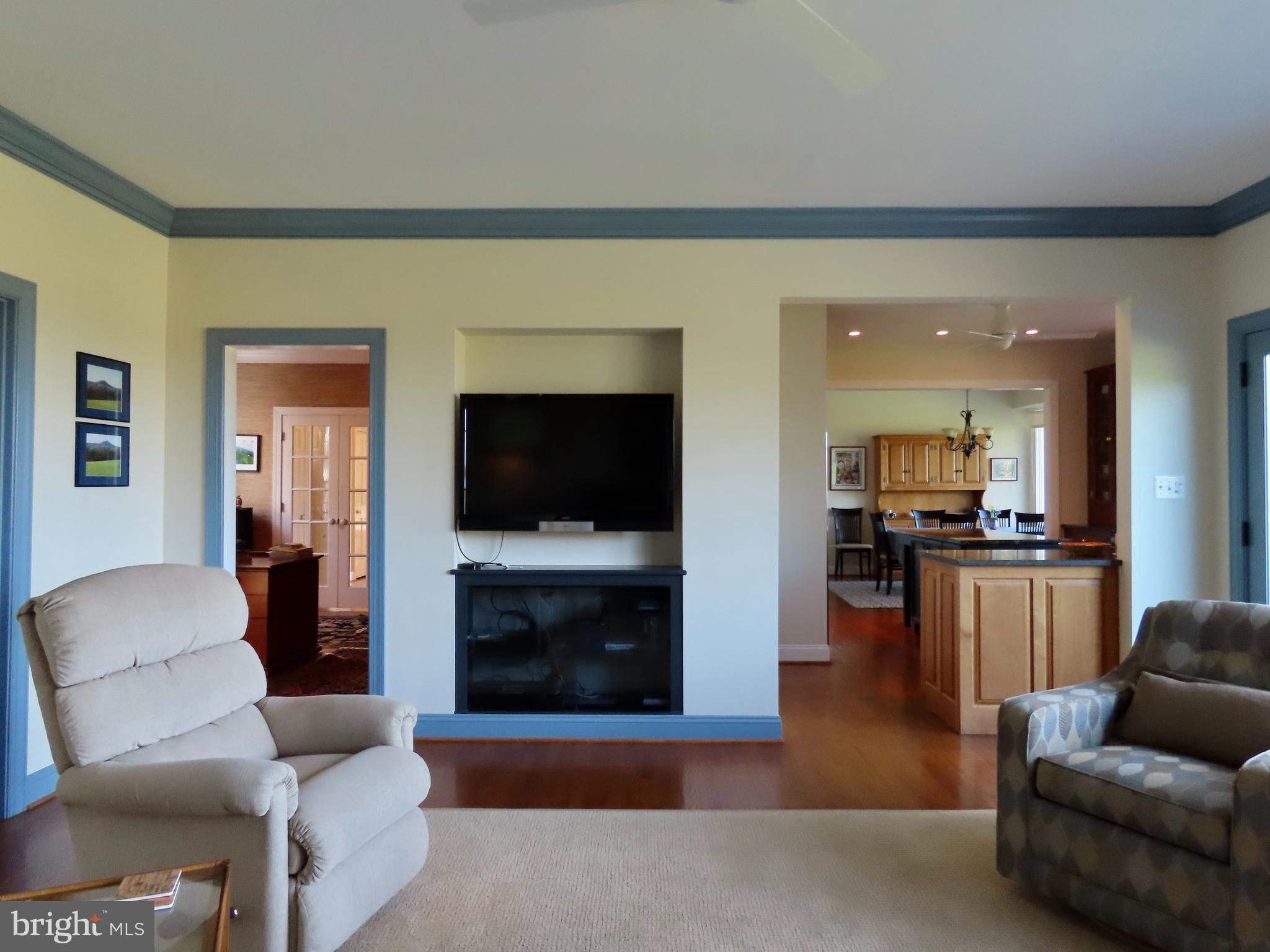 643 Richmond Road Amissville, VA 20106 - Photo 13 of 48 Family Room tv console and kitchen access