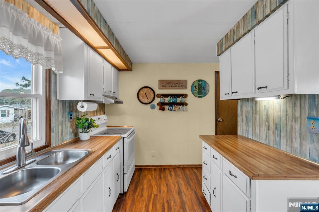 44 Nancy Lane Barnegat, NJ 08005 - Photo 11 of 23 a kitchen with a sink and a stove top oven