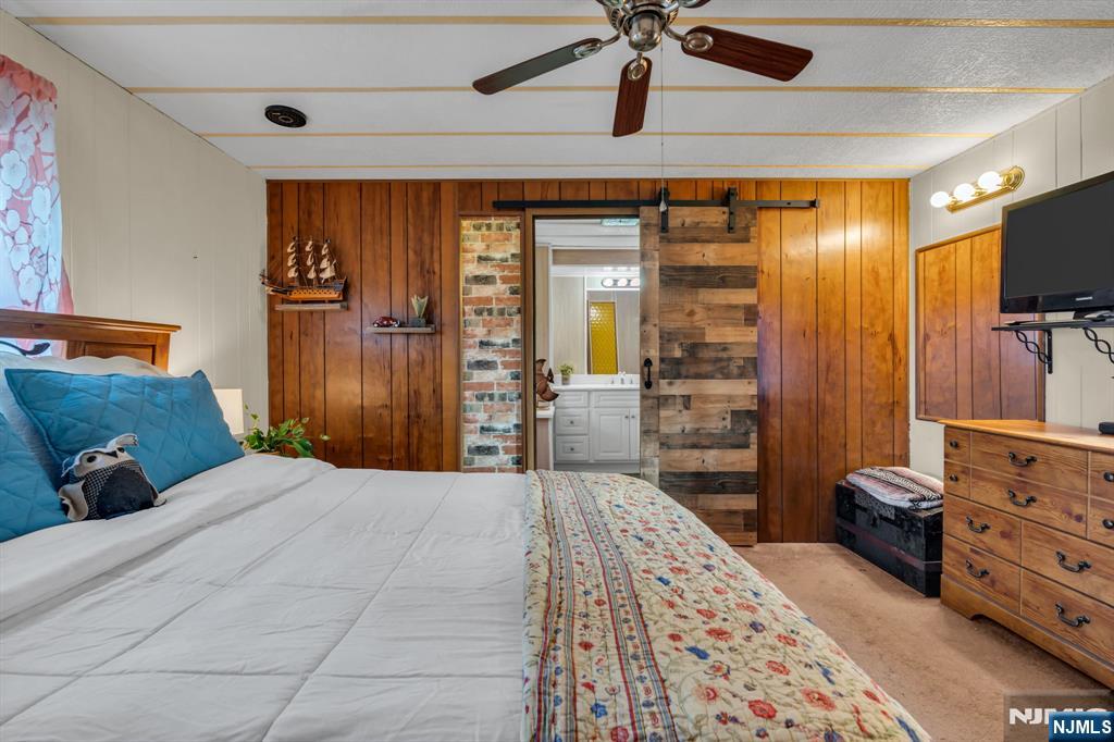 44 Nancy Lane Barnegat, NJ 08005 - Photo 15 of 23 a bedroom with a bed and a flat screen tv