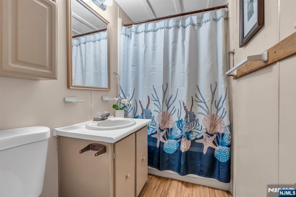 44 Nancy Lane Barnegat, NJ 08005 - Photo 19 of 23 a bathroom with a sink and a mirror