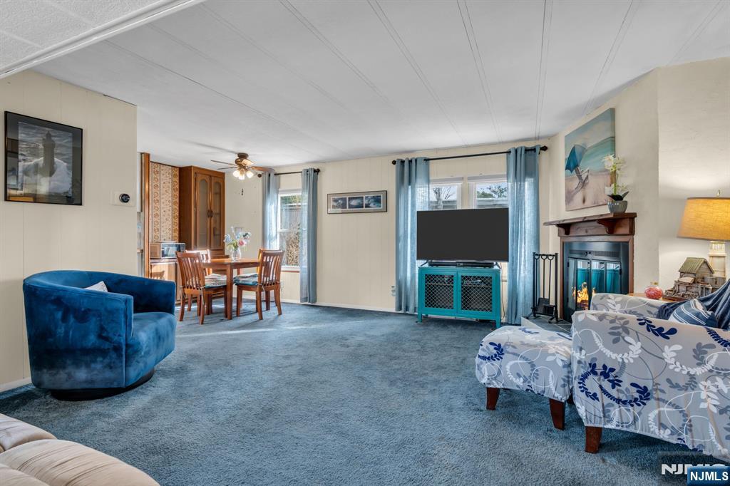 44 Nancy Lane Barnegat, NJ 08005 - Photo 3 of 23 a living room with furniture and a flat screen tv