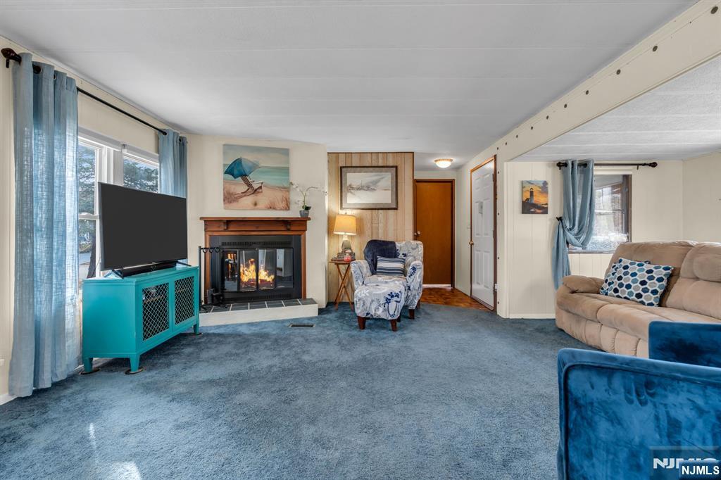 44 Nancy Lane Barnegat, NJ 08005 - Photo 5 of 23 a living room with furniture and a flat screen tv