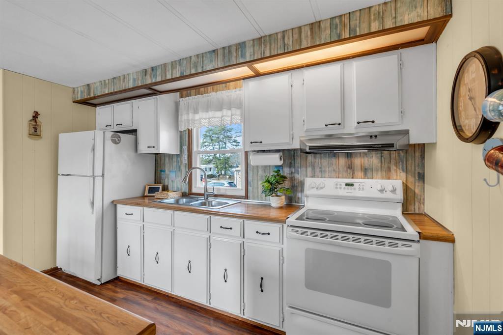 44 Nancy Lane Barnegat, NJ 08005 - Photo 9 of 23 a kitchen with stainless steel appliances granite countertop a stove a refrigerator and a white cabinets