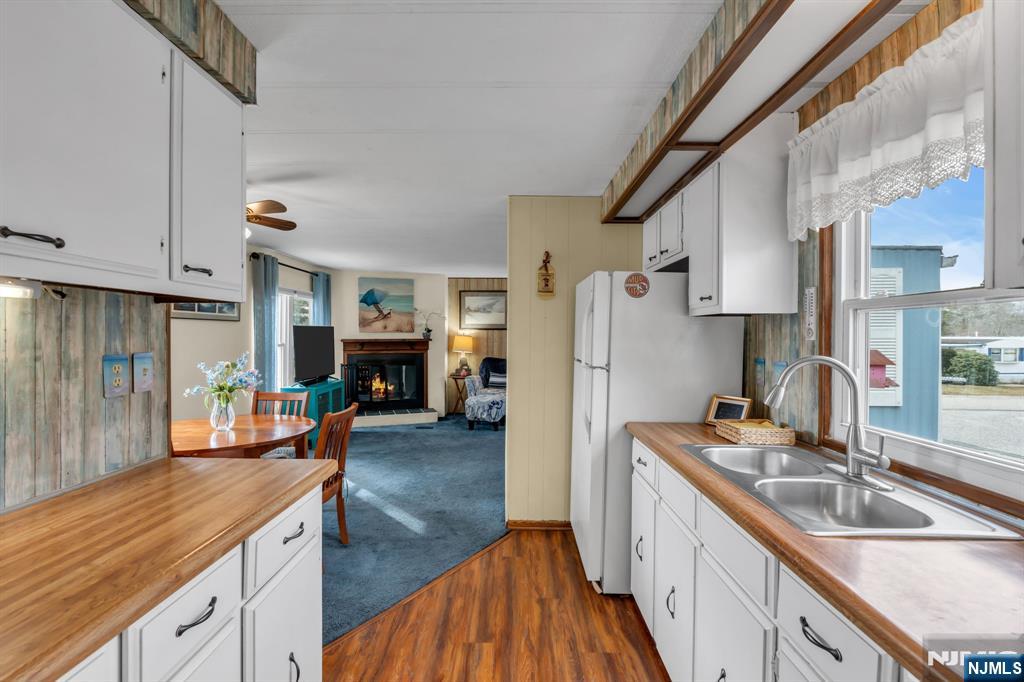 44 Nancy Lane Barnegat, NJ 08005 - Photo 10 of 23 a kitchen with wooden cabinets and sink