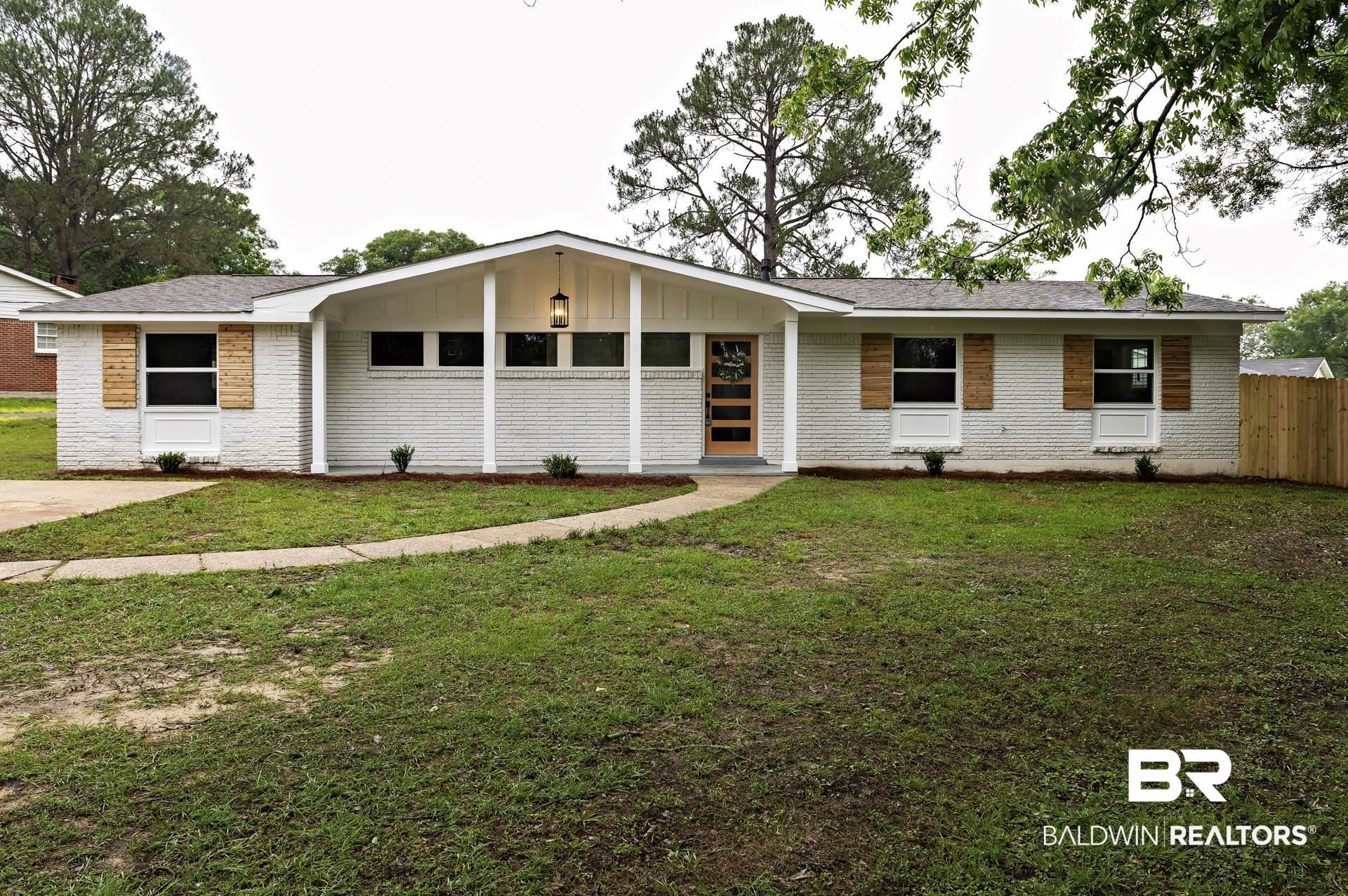 5922 Sunnyside Drive Mobile, AL 36619 - Photo 1 of 51 View of front of property featuring brick siding, board and batten siding, and roof with shingles