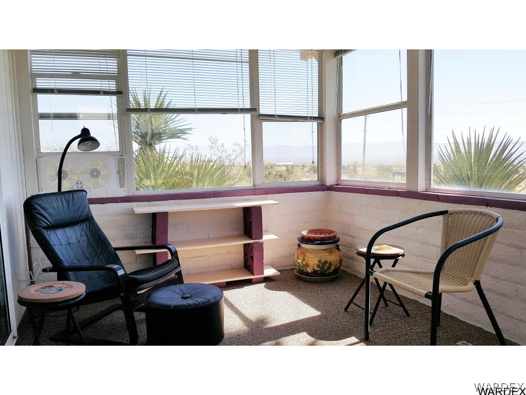 3256 South Tennessee Road Golden Valley, AZ 86413 - Photo 15 of 36 a living room with furniture and a large window
