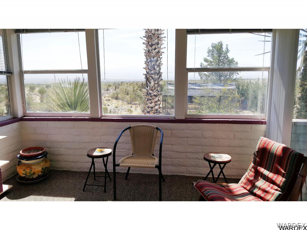 3256 South Tennessee Road Golden Valley, AZ 86413 - Photo 16 of 36 a living room with furniture and a large window