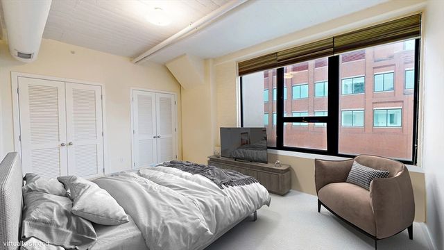 a bedroom with bed and furniture