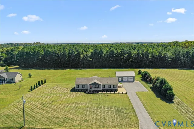 a view of a swimming pool with an outdoor seating and yard