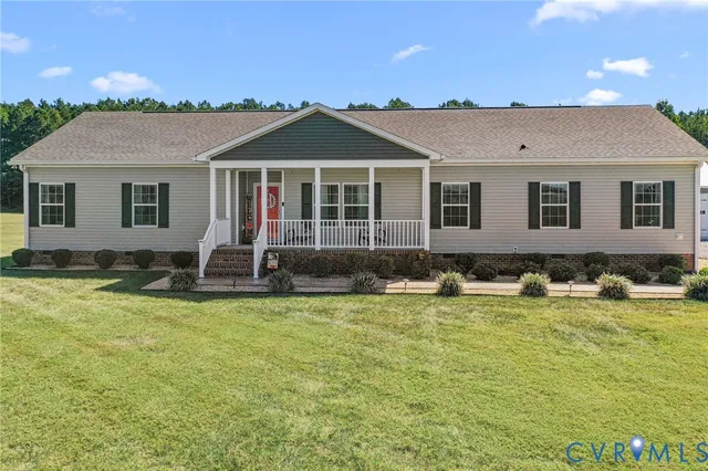 a view of a house with swimming pool and a yard