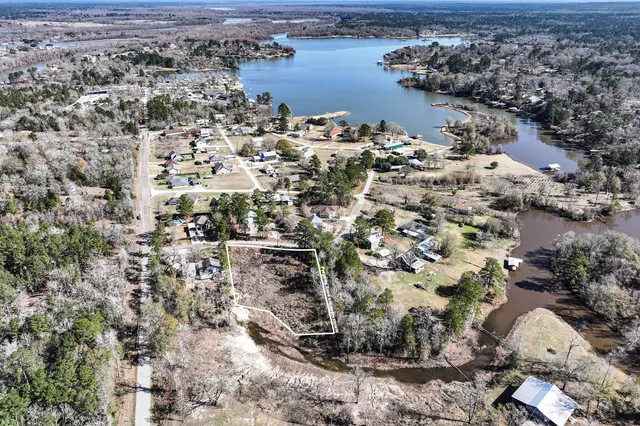 an aerial view of a houses with a yard
