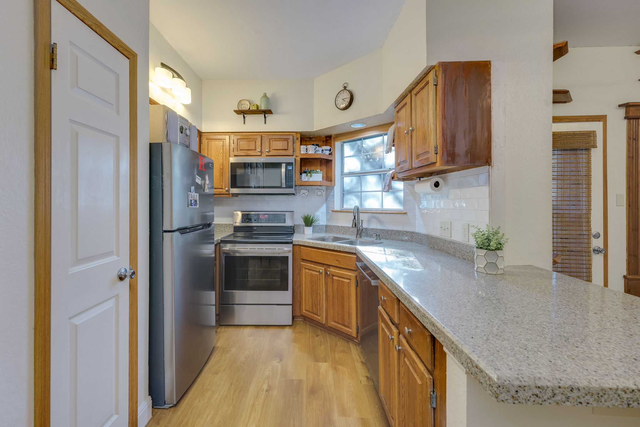 3809 Spicewood Springs Road, Unit 150 Austin, TX 78759 - Photo 20 of 35 a kitchen with stainless steel appliances granite countertop a sink stove and refrigerator