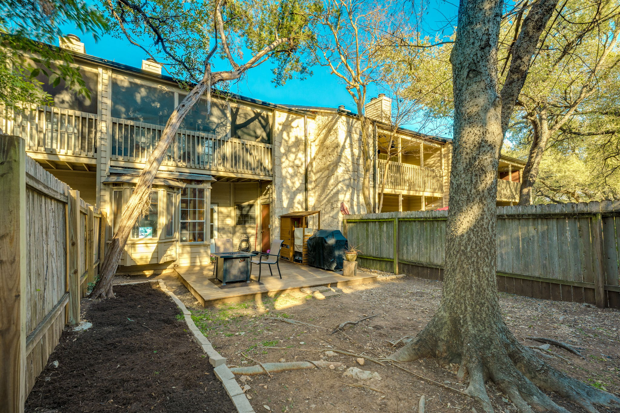 3809 Spicewood Springs Road, Unit 150 Austin, TX 78759 - Photo 33 of 35 a view of a house with a yard
