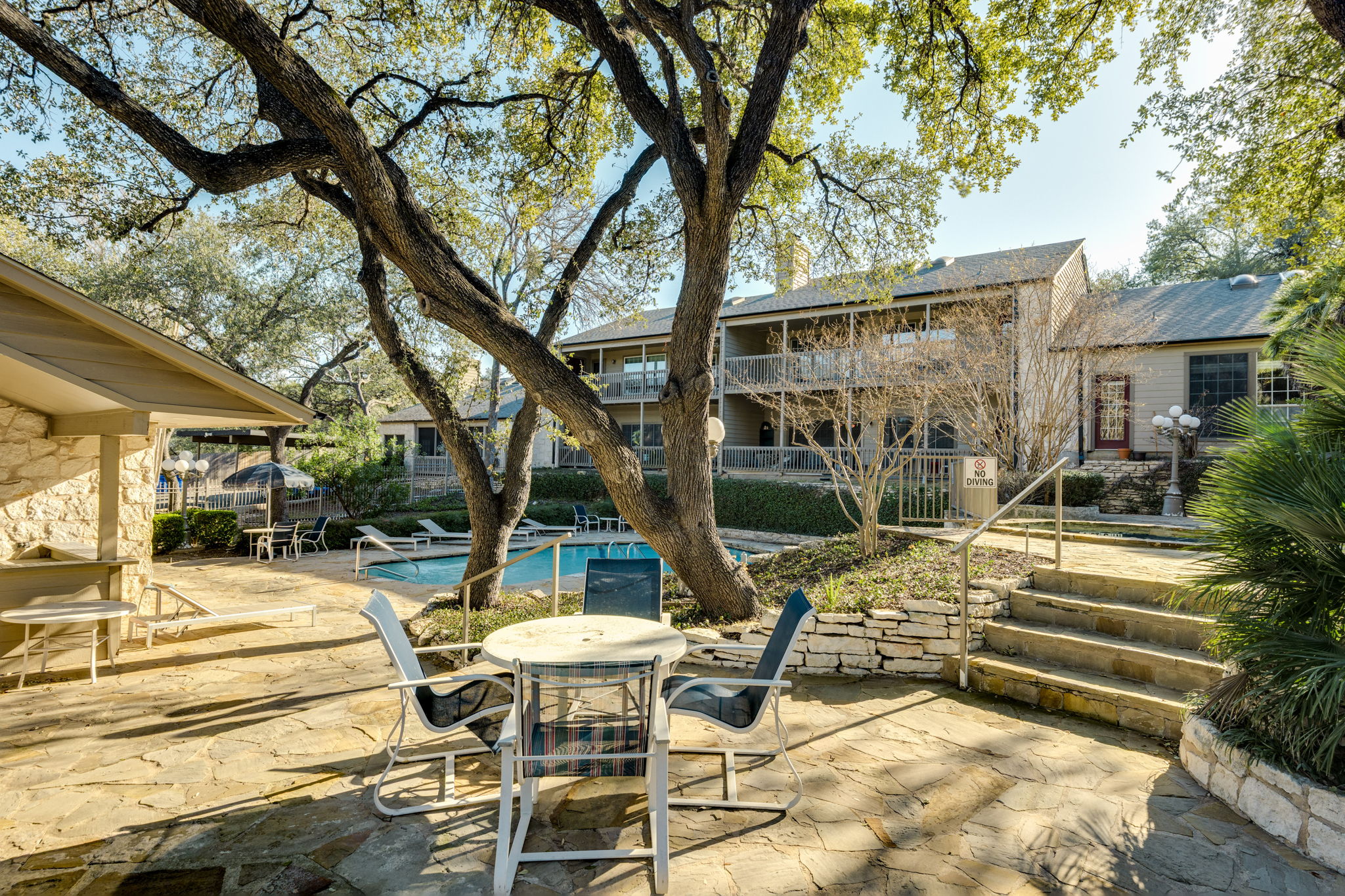 3809 Spicewood Springs Road, Unit 150 Austin, TX 78759 - Photo 7 of 35 a view of patio with table and chairs and potted plants