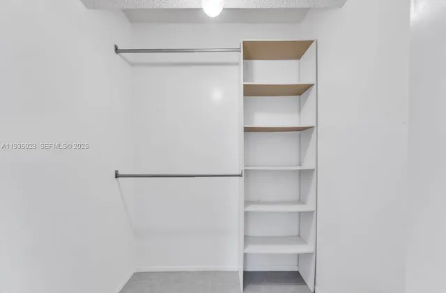 a view of an empty walk in closet