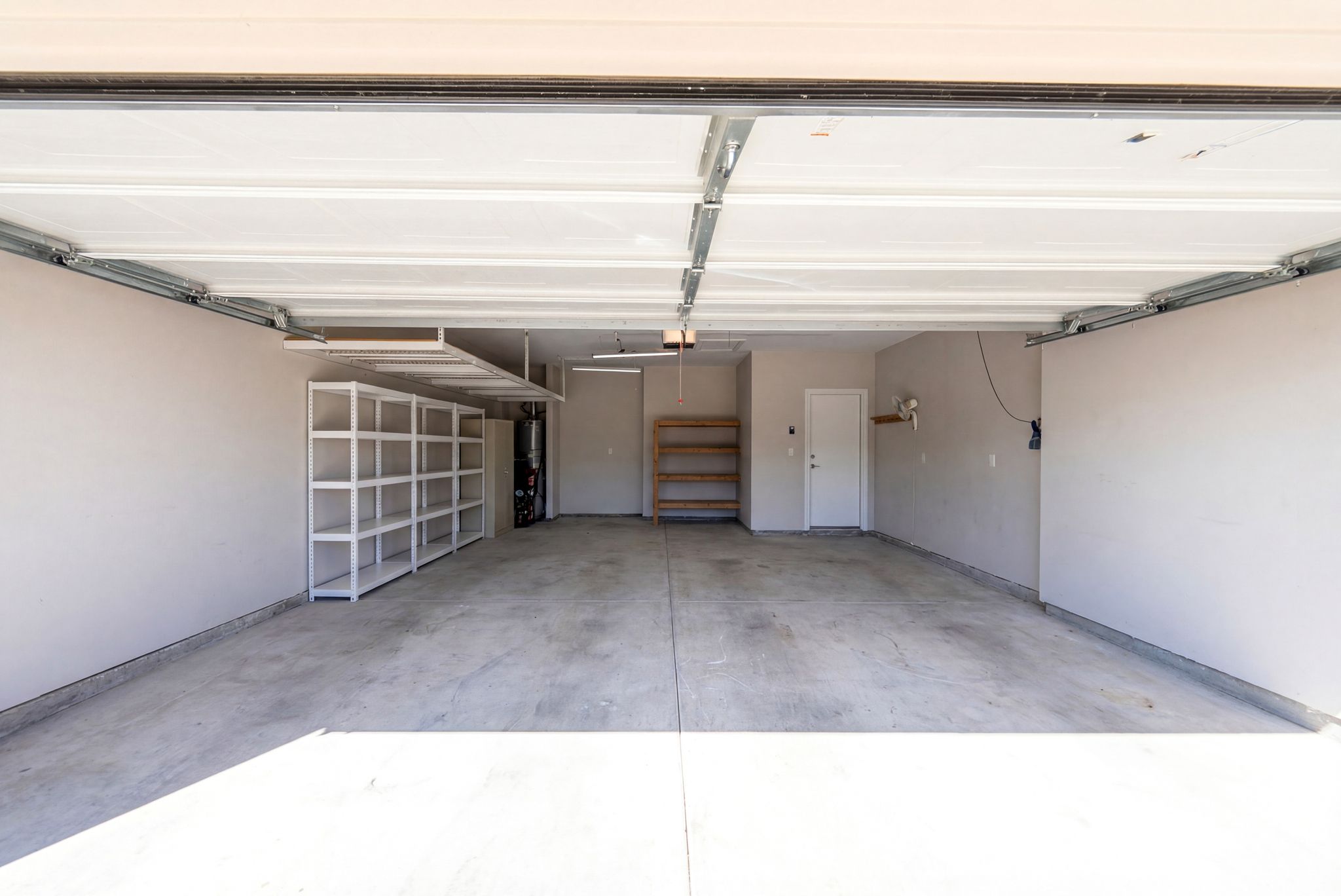 642 Martingale Street Georgetown, TX 78633 - Photo 40 of 40 The two-car garage is more than just a place for vehicles. With built-in heavy-duty shelving and an overhead storage rack, there is a dedicated place for every tool, holiday decoration, and hobby kit.