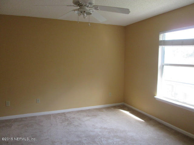 705 South Covered Bridge Road, Unit 2 St. Johns, FL 32259 - Photo 11 of 13 an empty room with a window