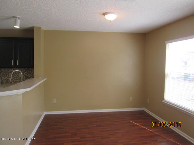 705 South Covered Bridge Road, Unit 2 St. Johns, FL 32259 - Photo 3 of 13 a view of an empty room with closet and a window