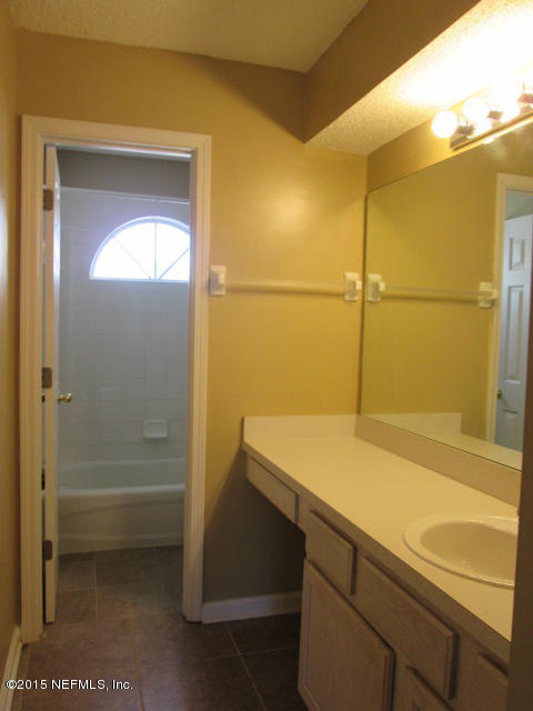 705 South Covered Bridge Road, Unit 2 St. Johns, FL 32259 - Photo 10 of 13 a bathroom with a shower and a sink
