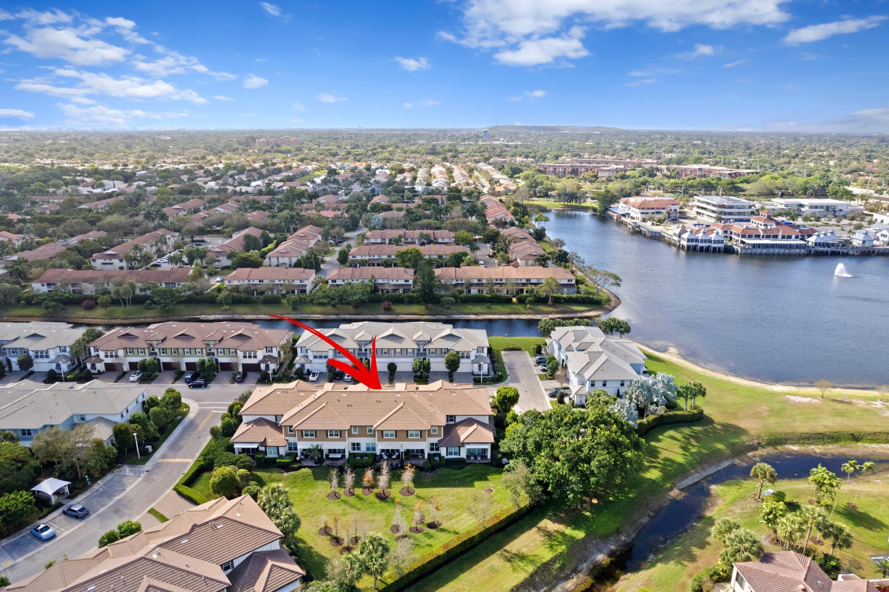 6693 Quiet Wave Trail, Unit 41 Boca Raton, FL 33433 - Photo 1 of 40 an aerial view of a house with a lake view