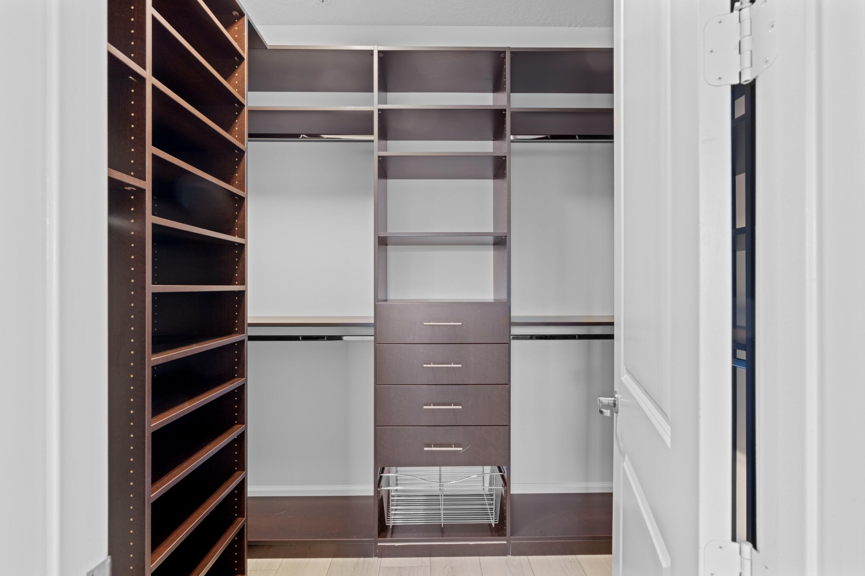 6693 Quiet Wave Trail, Unit 41 Boca Raton, FL 33433 - Photo 11 of 40 a view of walk in closet with empty racks