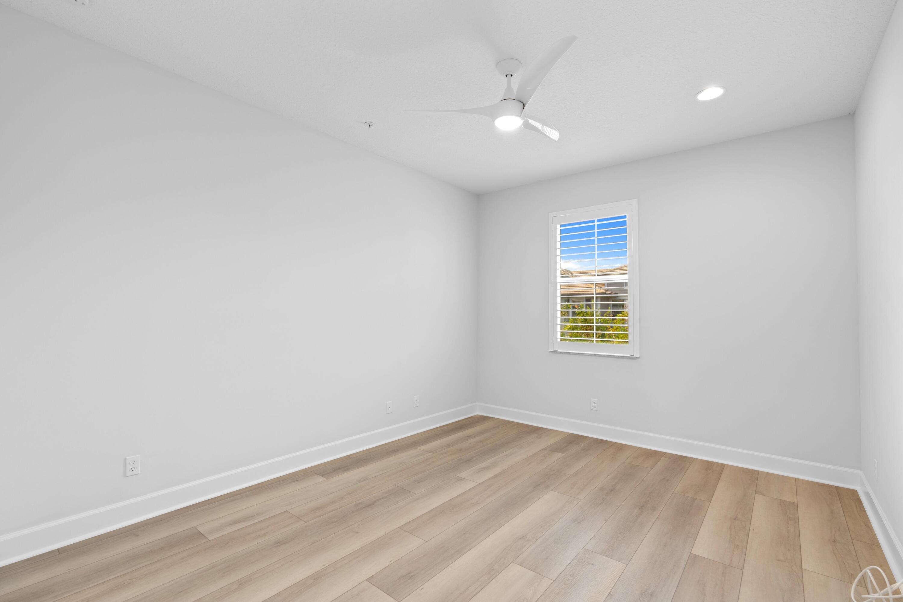 6693 Quiet Wave Trail, Unit 41 Boca Raton, FL 33433 - Photo 16 of 40 wooden floor in an empty room