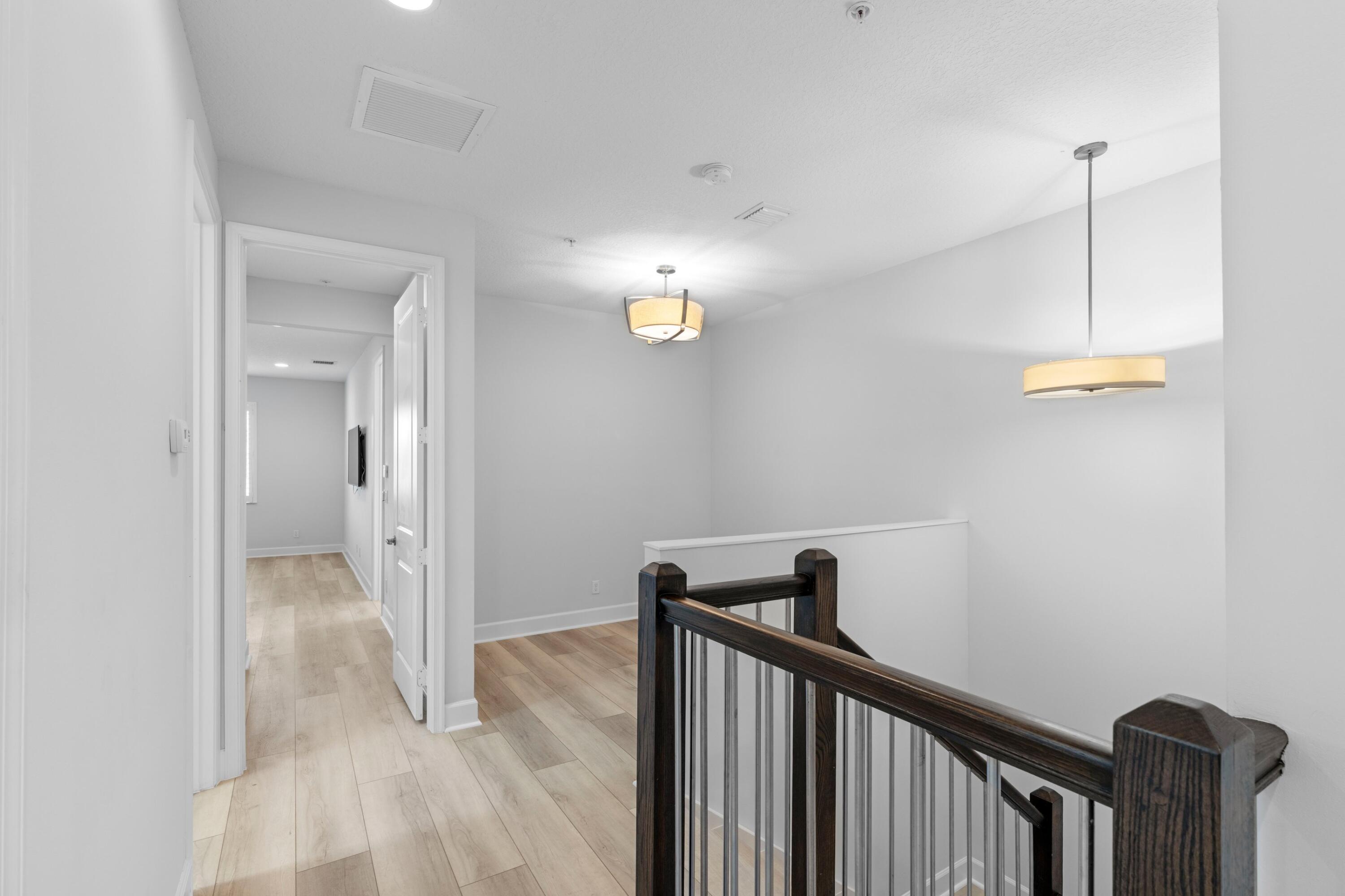 6693 Quiet Wave Trail, Unit 41 Boca Raton, FL 33433 - Photo 17 of 40 a view of a hallway view with staircase