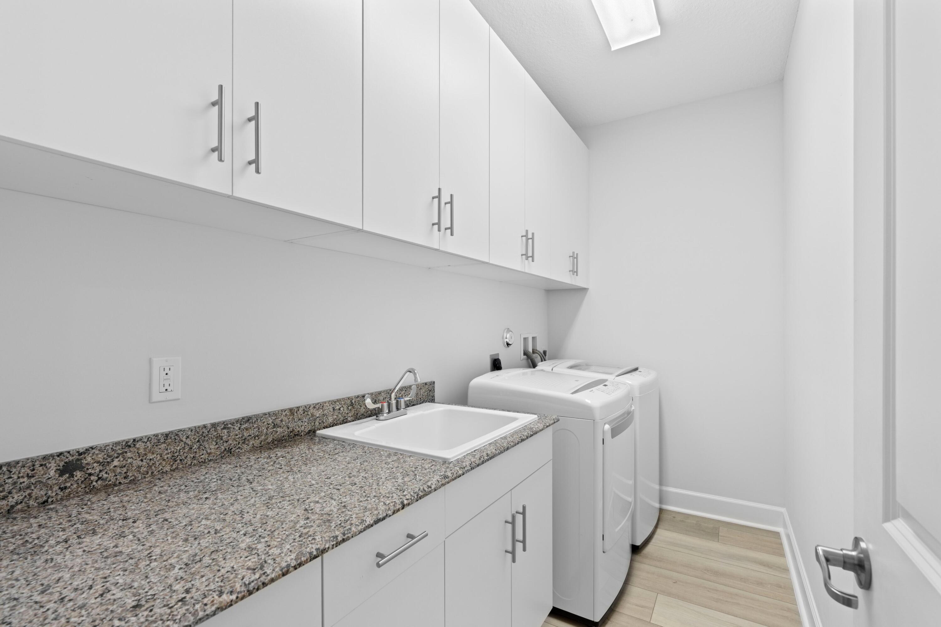 6693 Quiet Wave Trail, Unit 41 Boca Raton, FL 33433 - Photo 19 of 40 a utility room with sink dryer and washer