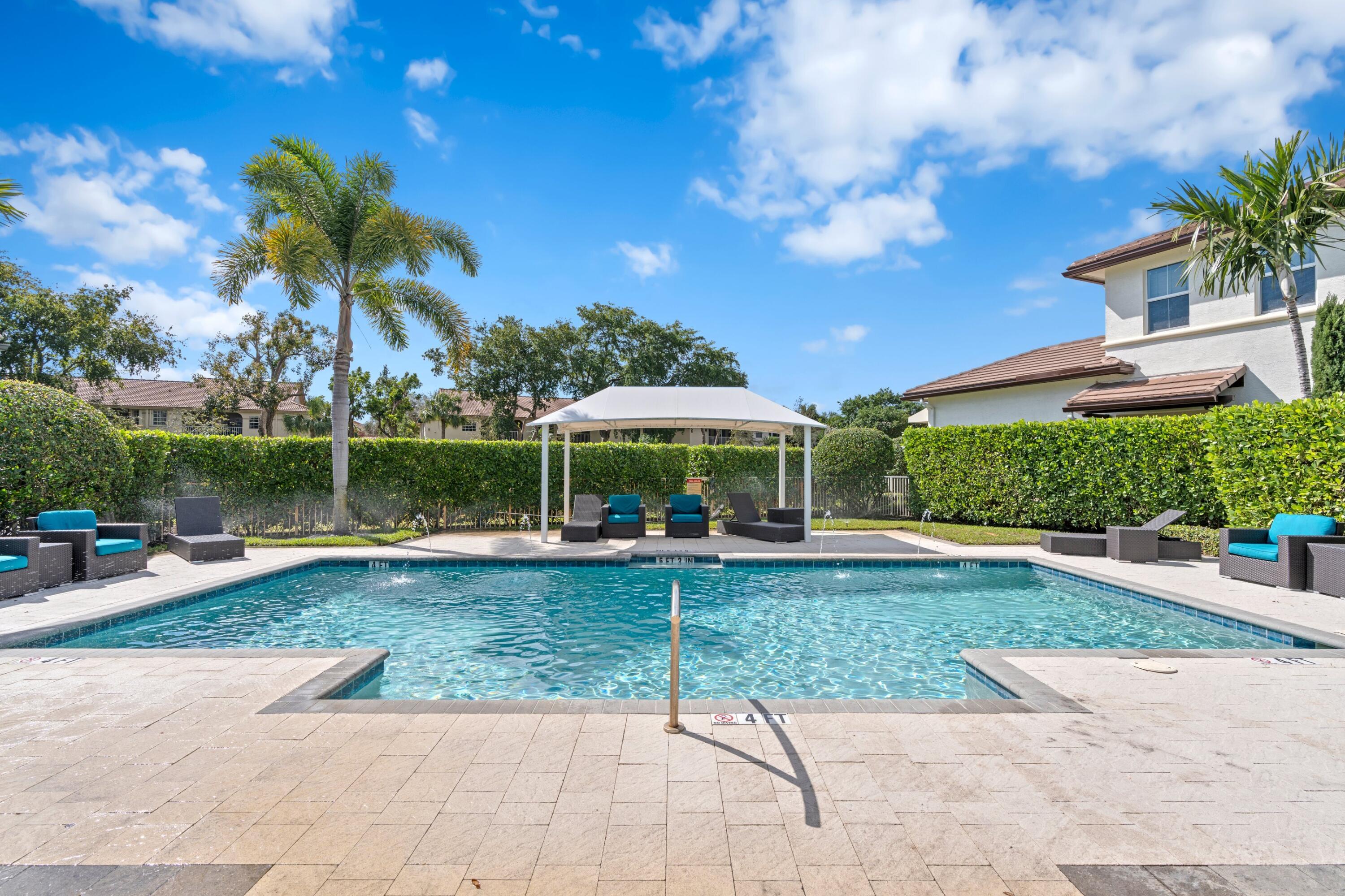 6693 Quiet Wave Trail, Unit 41 Boca Raton, FL 33433 - Photo 25 of 40 a view of a garden with a slide