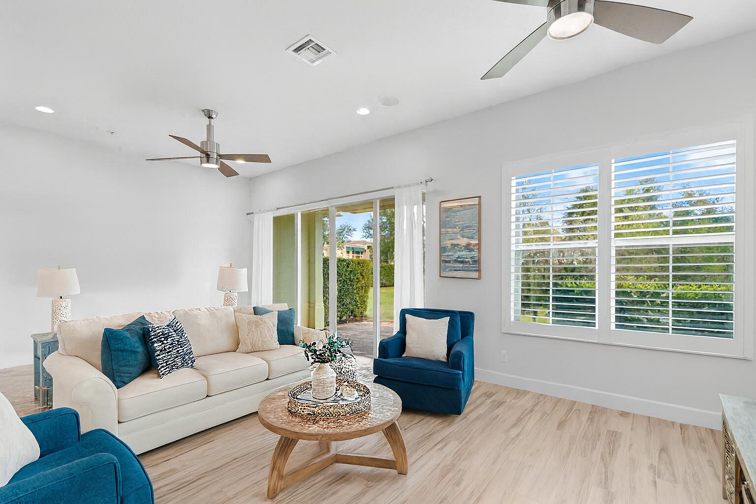 6693 Quiet Wave Trail, Unit 41 Boca Raton, FL 33433 - Photo 7 of 40 a living room with furniture and a window