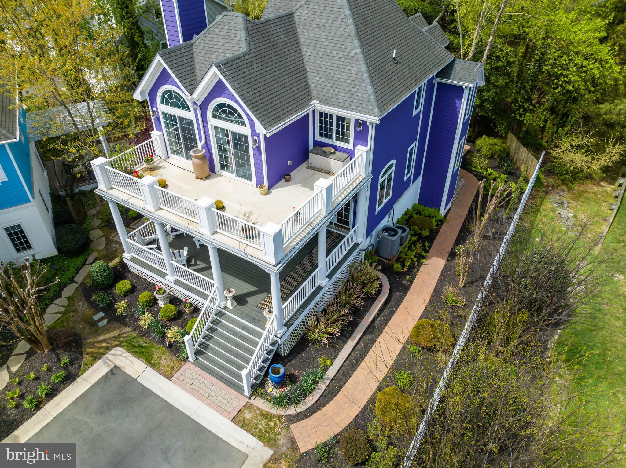 a aerial view of a house with balcony and deck