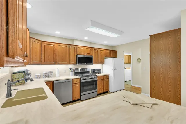 a kitchen with sink and cabinets