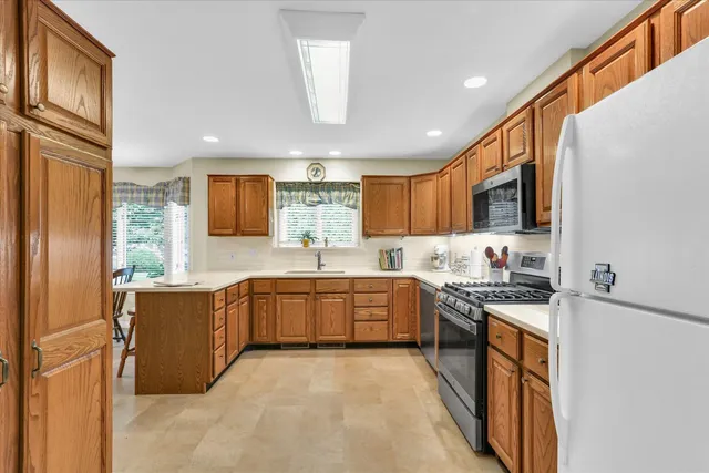a kitchen with a sink cabinets and window