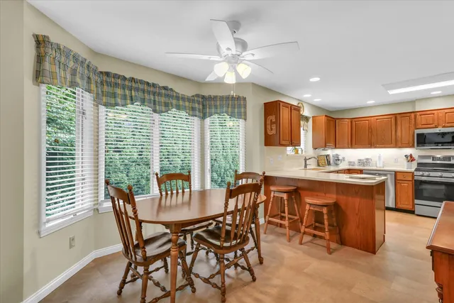 a view of a livingroom with furniture and staircase