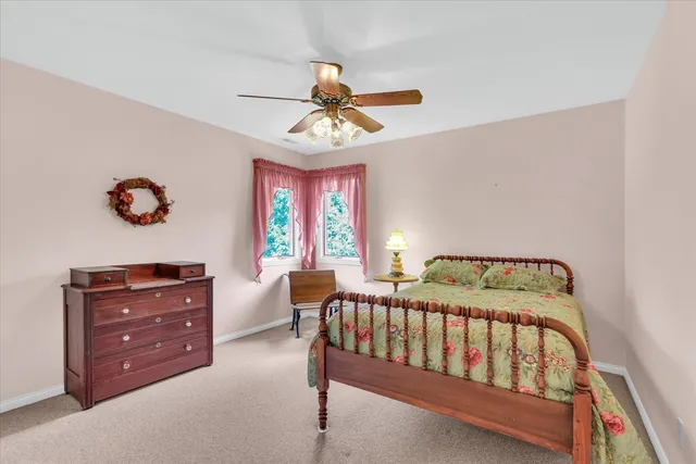 a view of a patio with table and chairs and potted plants