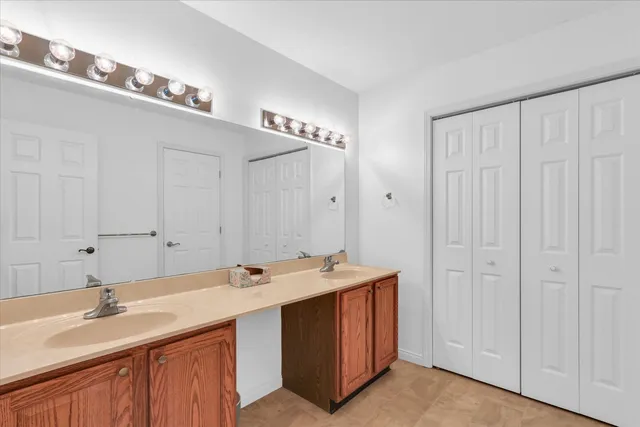 a patio with table and chairs and potted plants