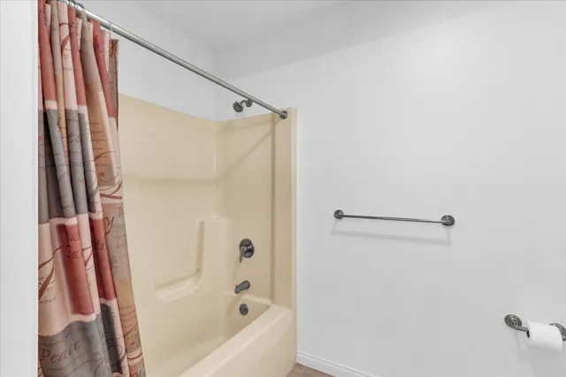 a view of an outdoor sitting area with furniture and wooden floor
