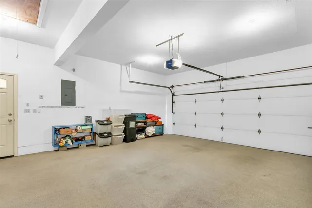 a view of a patio with table and chairs with wooden floor and fence