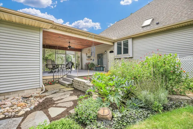 an aerial view of residential house with outdoor space and trees