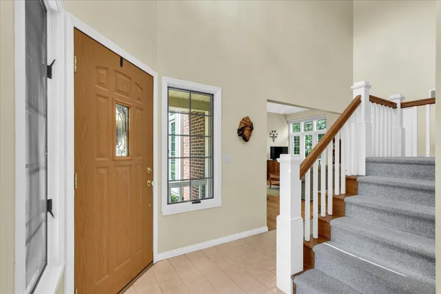 a view of a livingroom with furniture hardwood and a flat screen tv