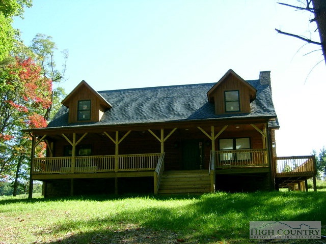 1017 Blue Ridge Church Road Purlear, NC 28665 - Photo 1 of 1 a view of a house with a yard